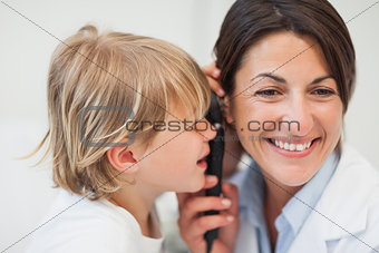 Child playing with examination tool