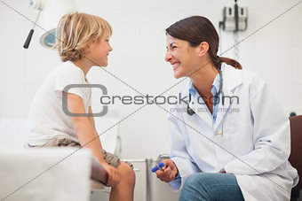 Doctor smiling to a child
