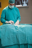 Surgeon operating a patient
