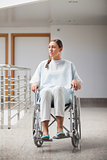 Front view of a thoughtful patient sitting on a wheelchair