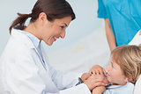 Doctor holding hands of a child