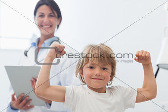 Happy child next to a doctor