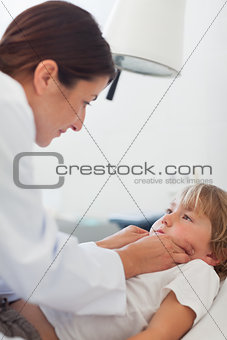 Doctor auscultating a child