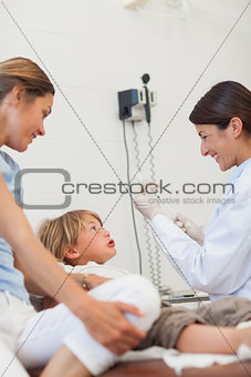 Afraid child looking at a syringe