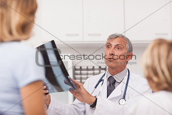 Doctor explaining the X-ray to patients
