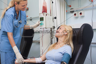 Nurse checking the pulse of a patient