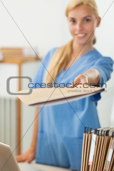 Nurse holding a file