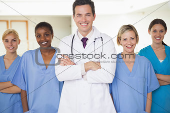 Nurses surrounding a doctor
