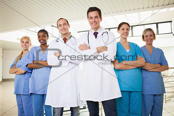Doctors with nurses with arms crossed