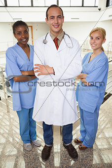 Doctor and nurses looking at camera