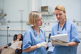 Nurses looking at a clipboard