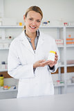 Pharmacist presenting a drug box