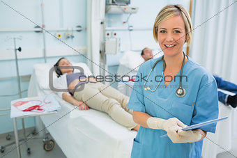 Smiling nurse next to transfused patients