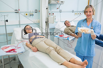Nurse holding a biscuits plate