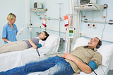 Patients lying on beds