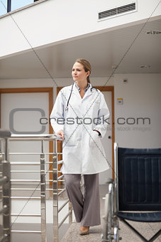 Doctor standing next to a wheelchair