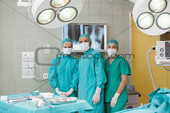 Serious medical team looking at camera