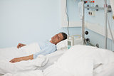 Male patient lying on a medical bed