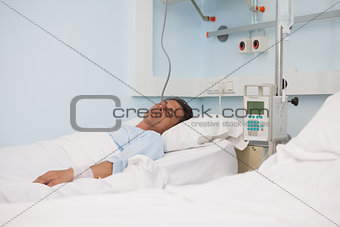 Asleep patient on a medical bed