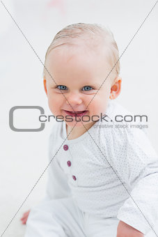 Baby looking at camera while smiling
