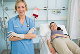 Nurse standing next to a female transfused patient