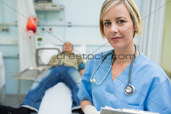 Nurse next to a transfused patient
