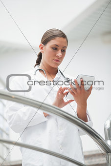 Female doctor touching a tablet computer