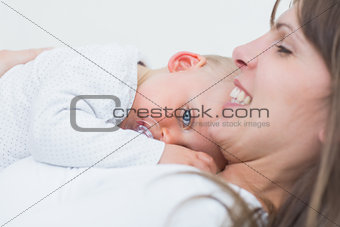 Baby lying on the chest of his mother