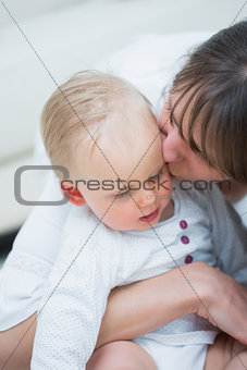 Mother kissing a baby