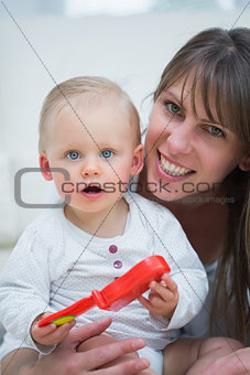 Baby holding a toy