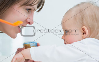 Mother face in front of a baby