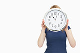 Blonde woman holding a clock