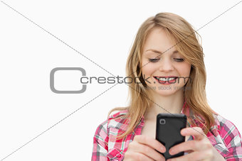 Smiling woman holding a mobile phone