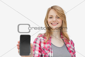 Woman showing a mobile phone