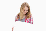 Woman holding a blank board while looking it