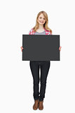 Woman holding a black board
