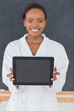 Focus on a black woman holding a tablet computer