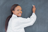 Black teacher holding a chalk