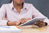Close up of a teacher using a tablet computer