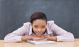 Black woman leaning her head on desk