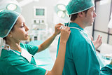 Nurse helping a surgeon