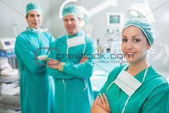 Surgical team with arms crossed