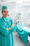 Surgeon with arms crossed smiling