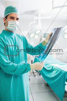 Surgeon holding a X-ray
