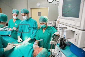 Surgical team next to a monitor