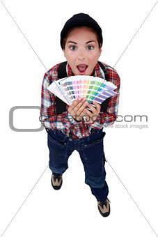 Woman choosing paint colour