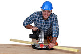 A carpenter with a circular saw.
