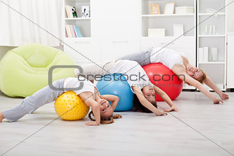 Kids and woman doing stretching exercises