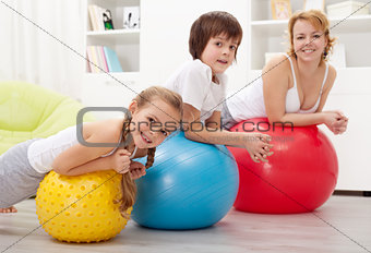 People exercising with large rubber balls
