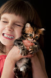 child with a kitten